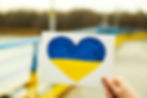 Person hands picture of the heart with Ukrainian flag