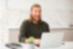 ENGin male volunteer look on the laptop screen and smile